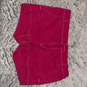 Hot pink shorts.